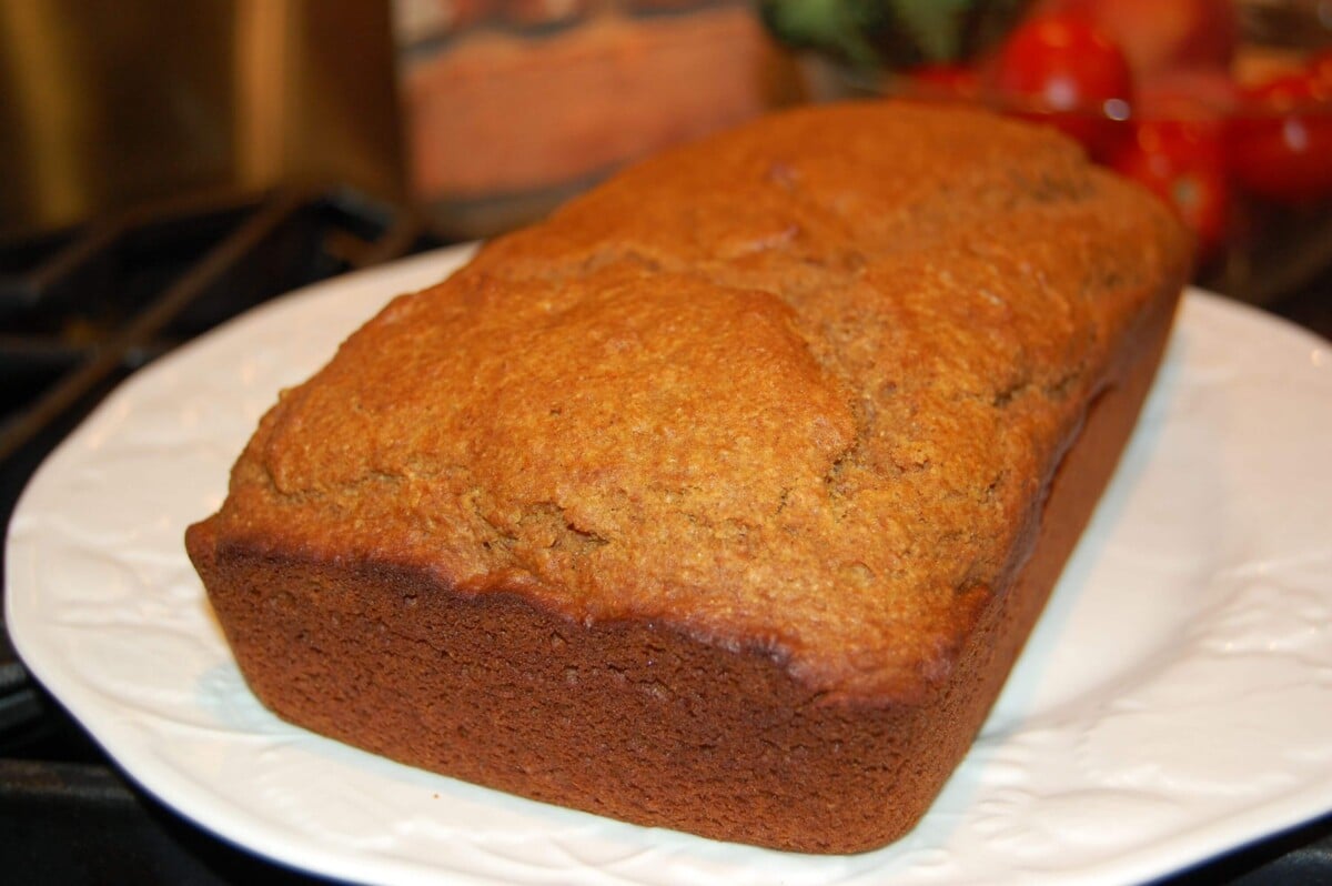 Pumpkin Bread loaf sitting on a white plate.