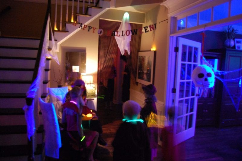 Inside of a house that is decorated for Halloween. 