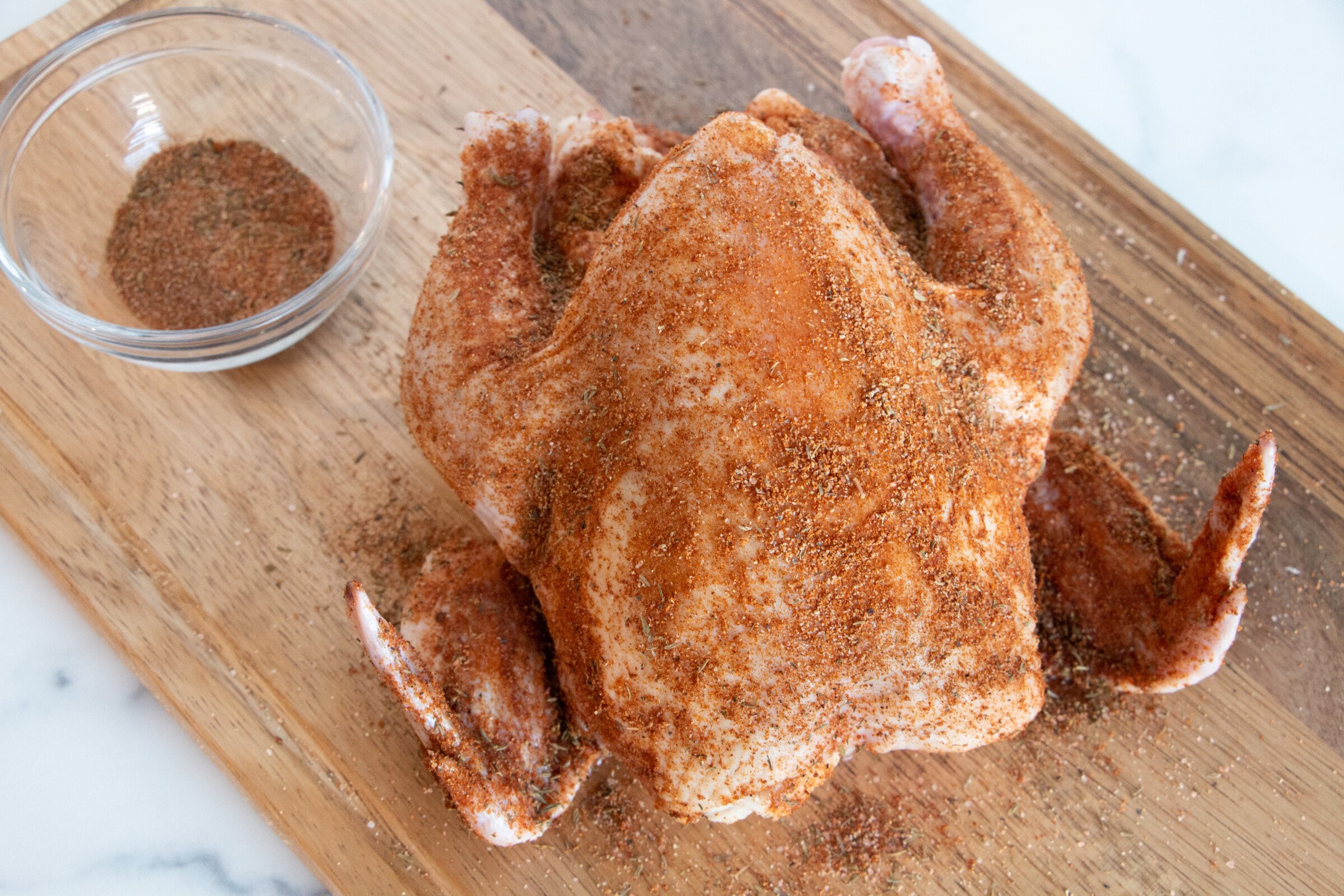 Rotisserie-style spiced whole chicken. Ready to add to the cooking pot.