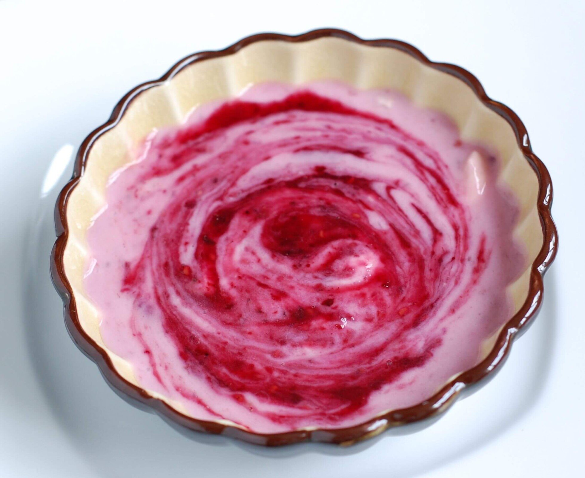 Berry Sauce swirled into plain yogurt from 100 Days of Real Food