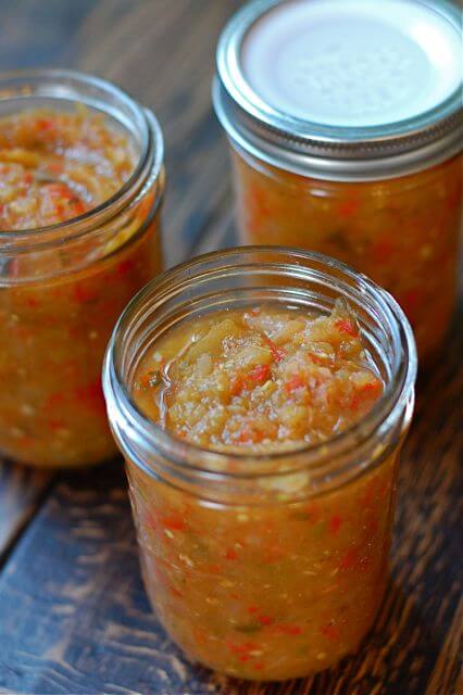 Three mason jars with canned relish.