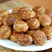 A batch of round pancakes on a plate