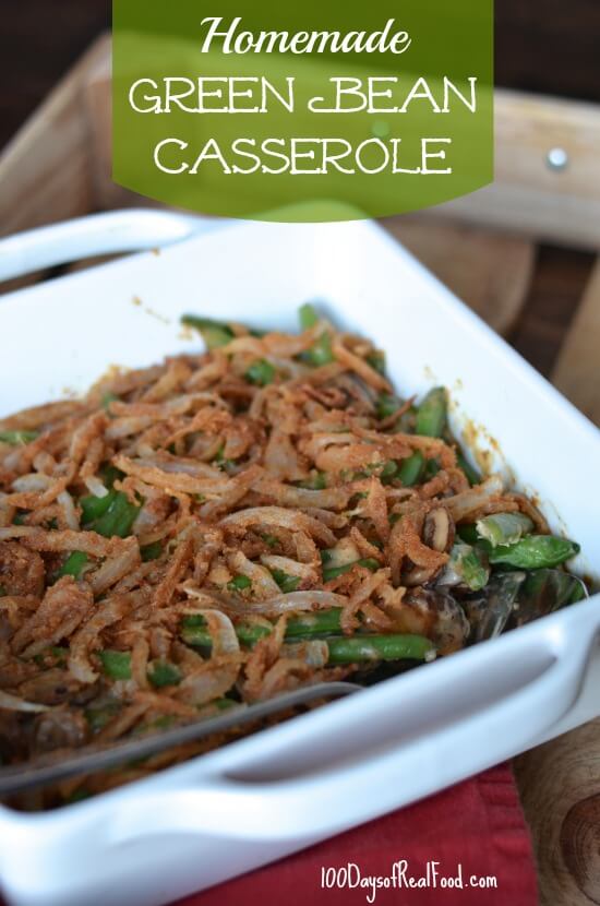 Homemade Green Bean Casserole topped with French onions in a white baking dish.