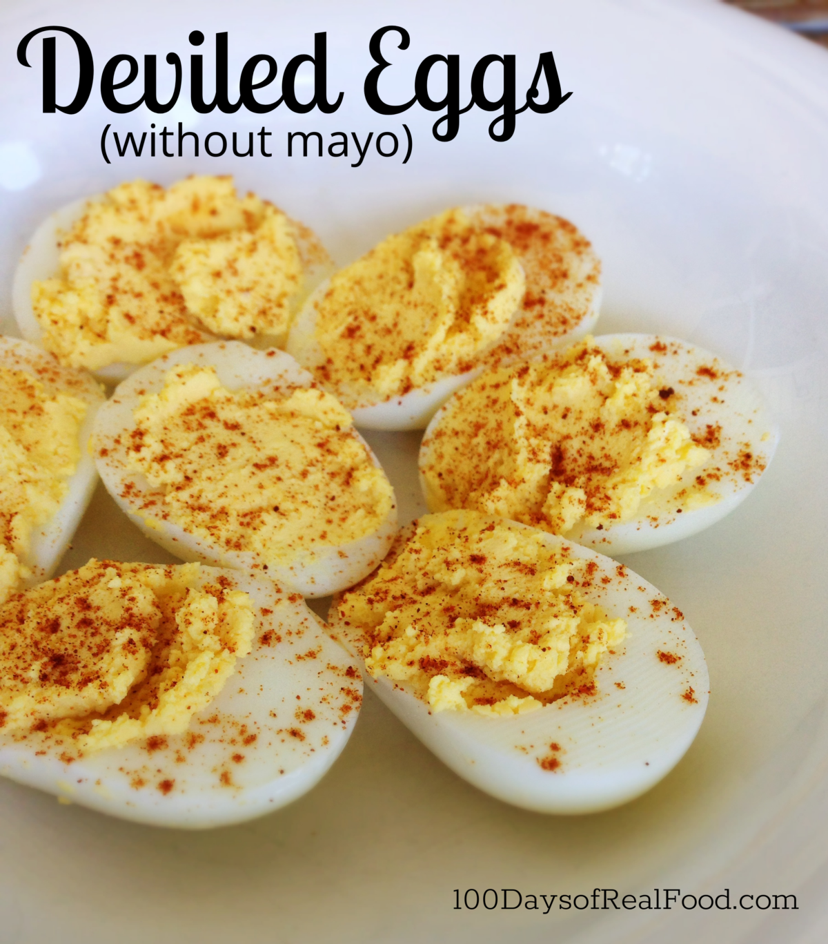 Deviled eggs on a plate sprinkled with paprika.