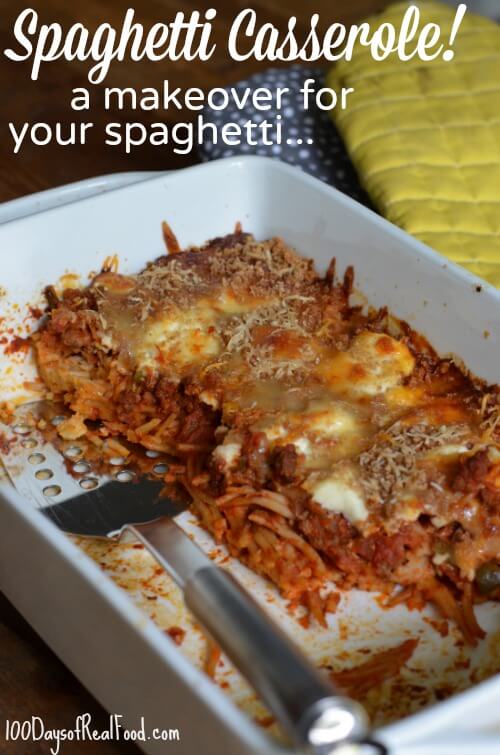 Spaghetti Casserole in a white casserole dish with a metal spatula taking out pieces to serve.