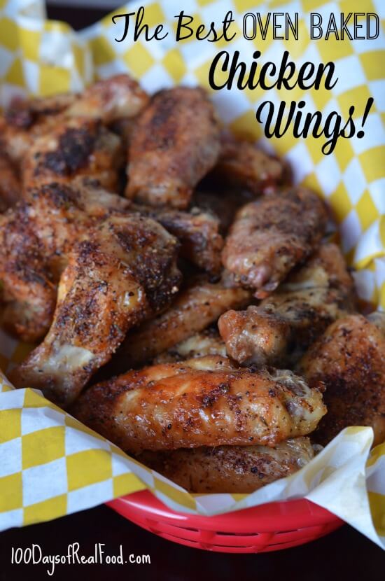 A batch of oven baked chicken wings in a basket.