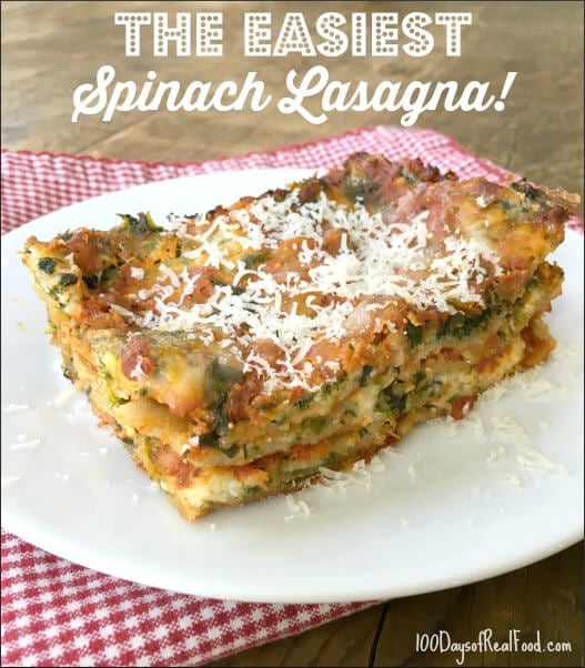 Spinach Lasagna topped with grated cheese on a plate. 