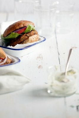 Loaded Black Bean Burgers Recipe by Andie Mitchell - these veggie burgers are packed with southwestern flavor and healthy vegetables. They're kid-friendly and freezer-friendly too!