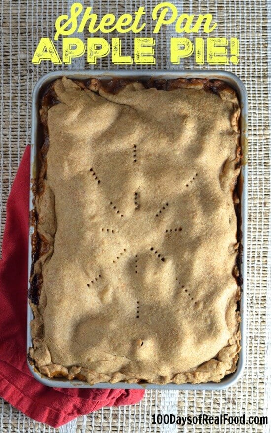 Sheet Pan Apple Pie sitting on a table with a red dish towel.