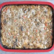 Creamy lentil lasagna in a red baking dish
