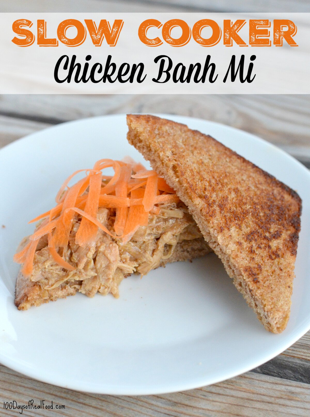 Slow Cooker Chicken Banh Mi on a slice of whole wheat toasted bread topped with shredded carrots.