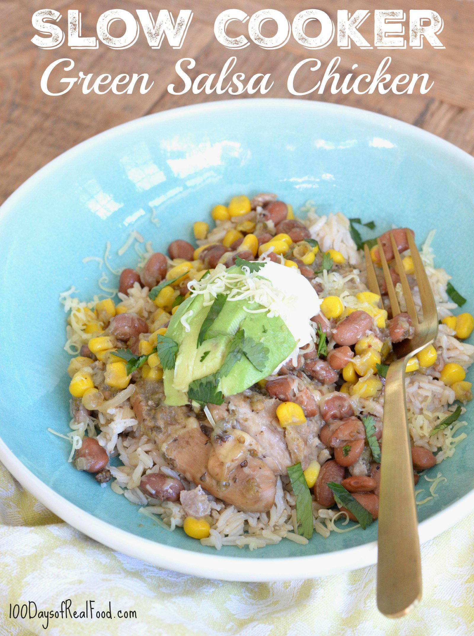 Slow Cooker Green Salsa Chicken in blue bowl on a table. 