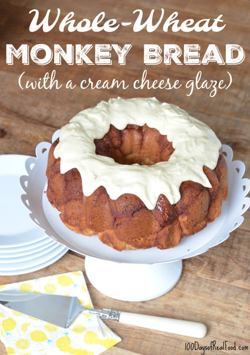 Whole Wheat Monkey Bread on cake stand with serving utensil