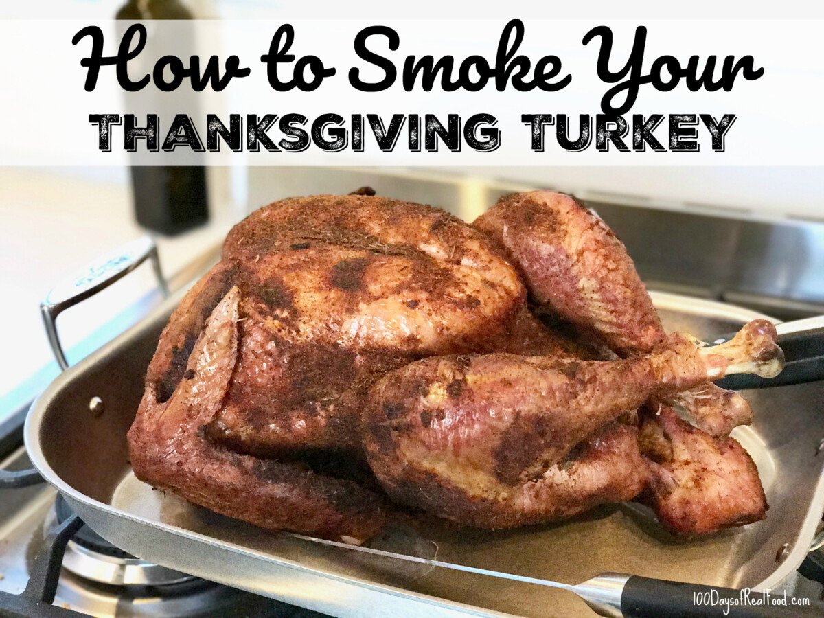 Large smoked turkey in a baking pan.