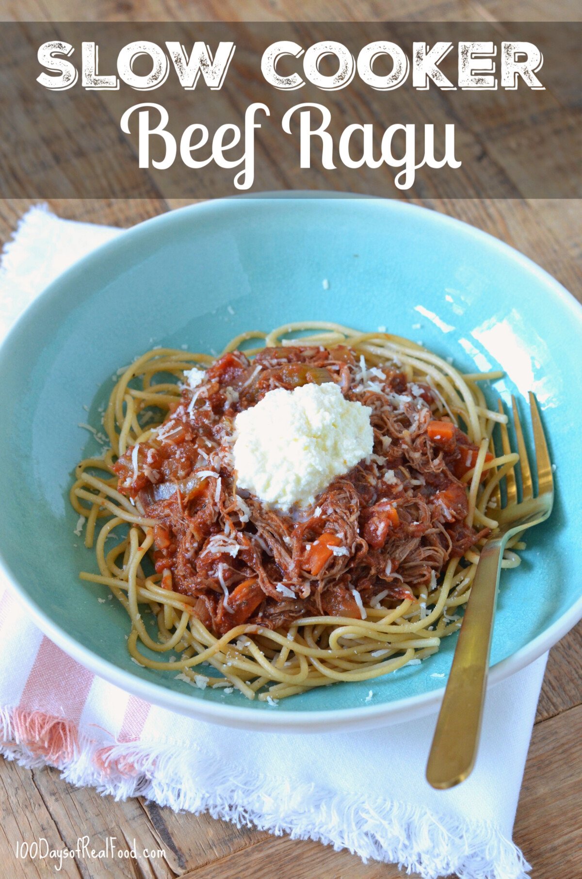 Slow Cooker Beef Ragu on top of whole-wheat spaghetti and topped with cheese.