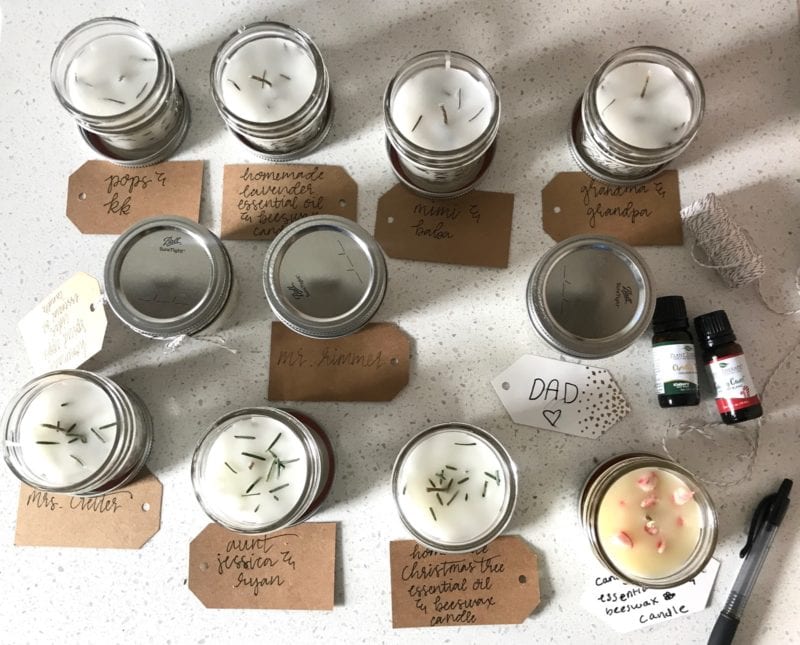 Natural homemade candles in jars  with hand written tags and scented oils. 