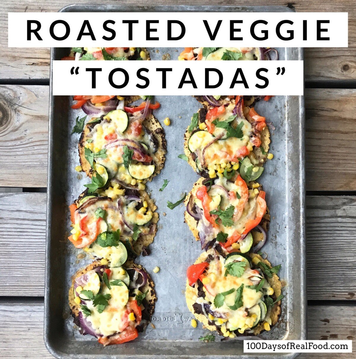 8 Roasted Veggie Tostada topped with melted cheese on a sheet pan