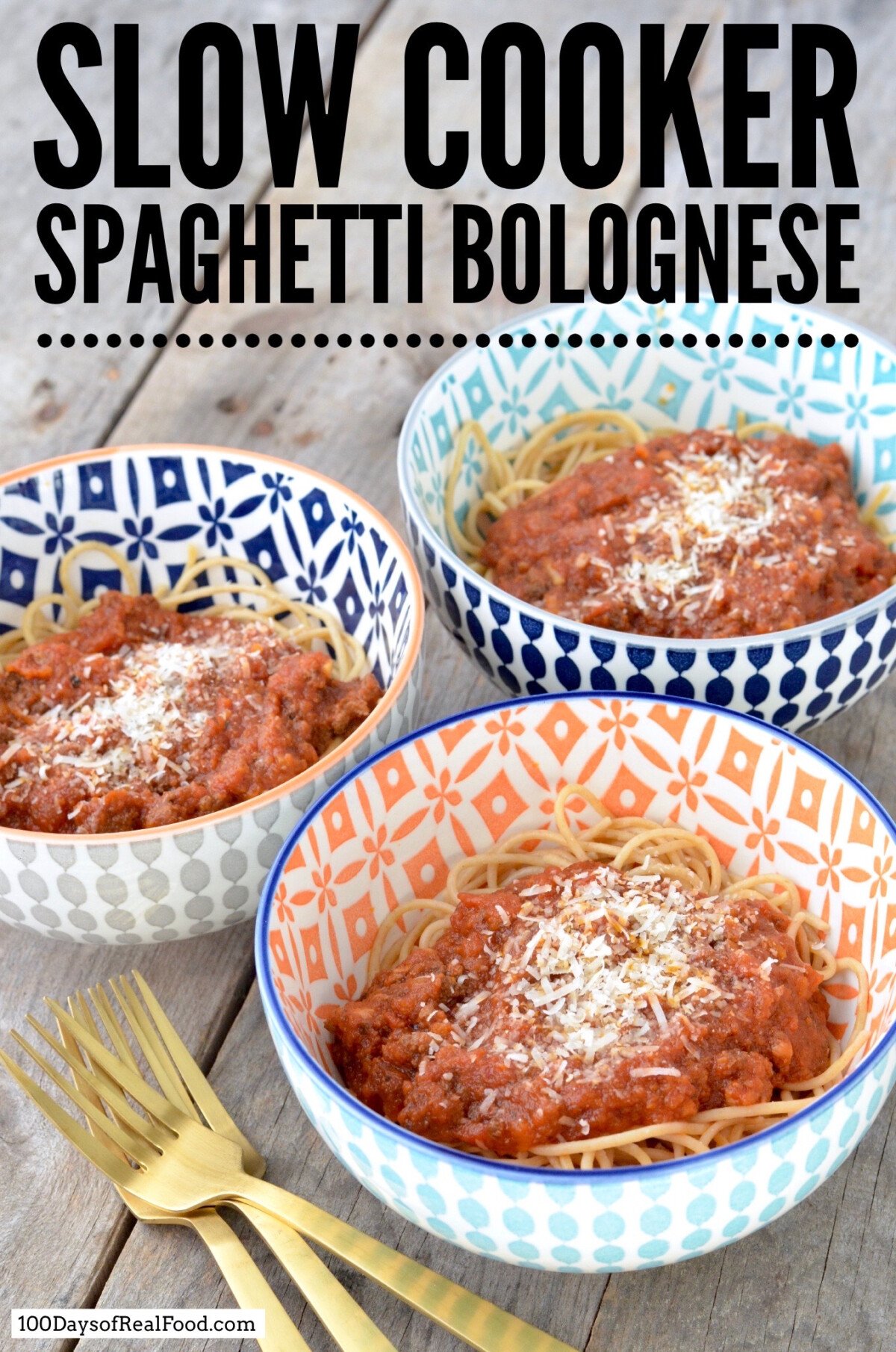 Three bright decorative bowls filled with spaghetti and topped with bolognese sauce with grated cheese.