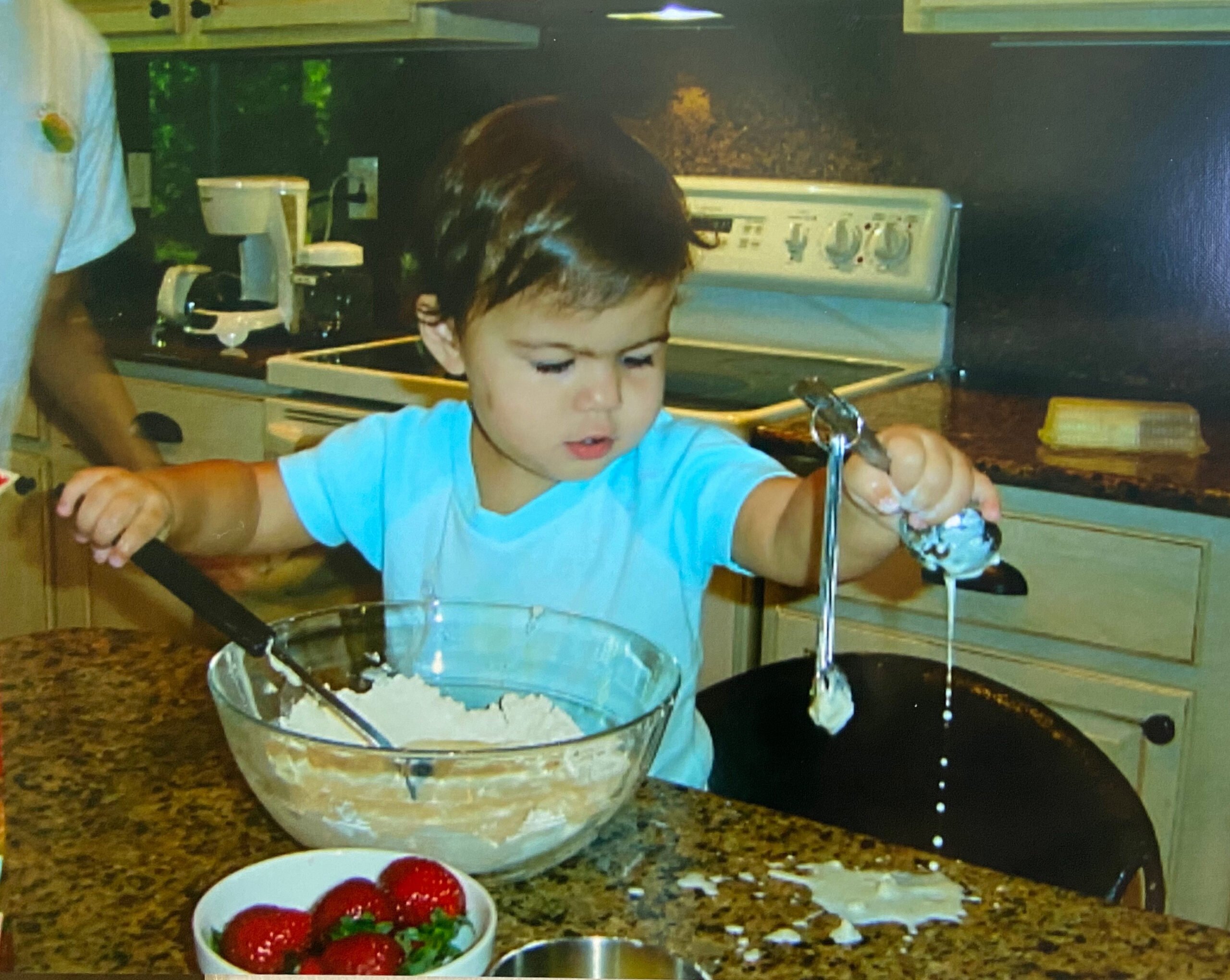 My daughter helping int he kitchen when she was a year and a half on 100 Days of Real Food