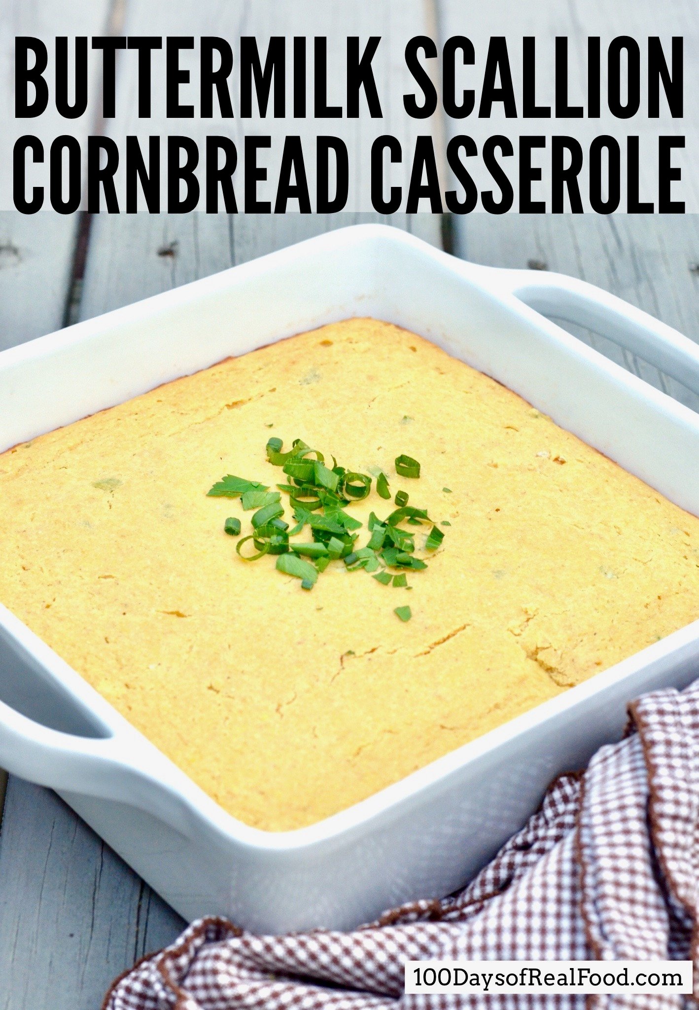 Buttermilk Scallion Cornbread Casserole in a white baking dish on a table