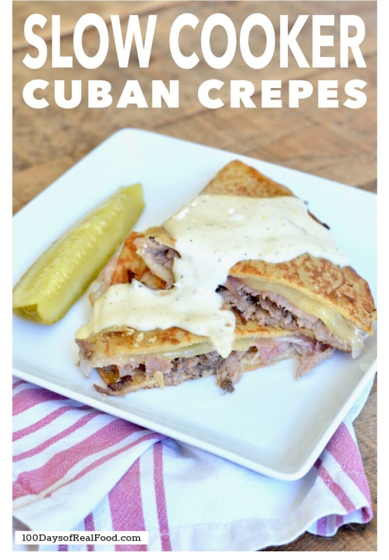 Cuban Crepes on a white plate with a pickle on the side