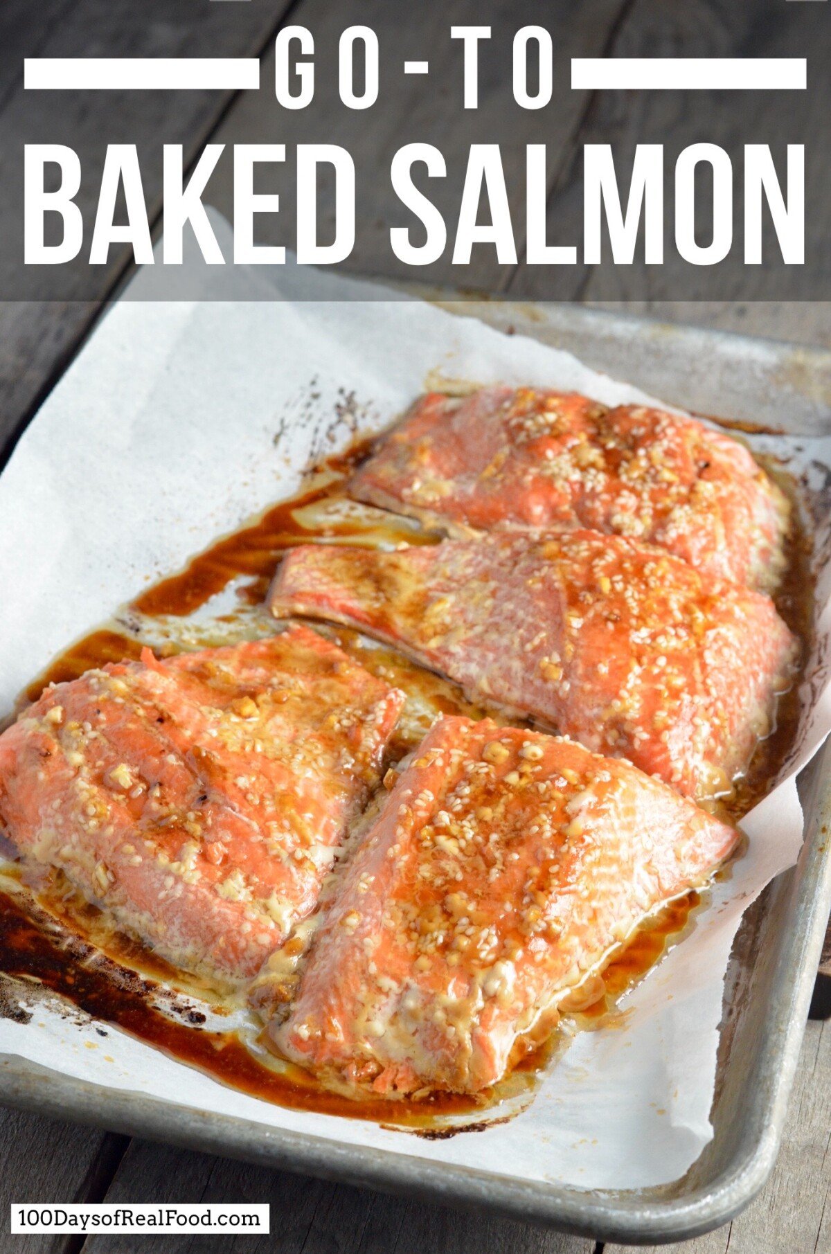 Four pieces of cooked salmon on a sheet pan that just came out of the oven. 