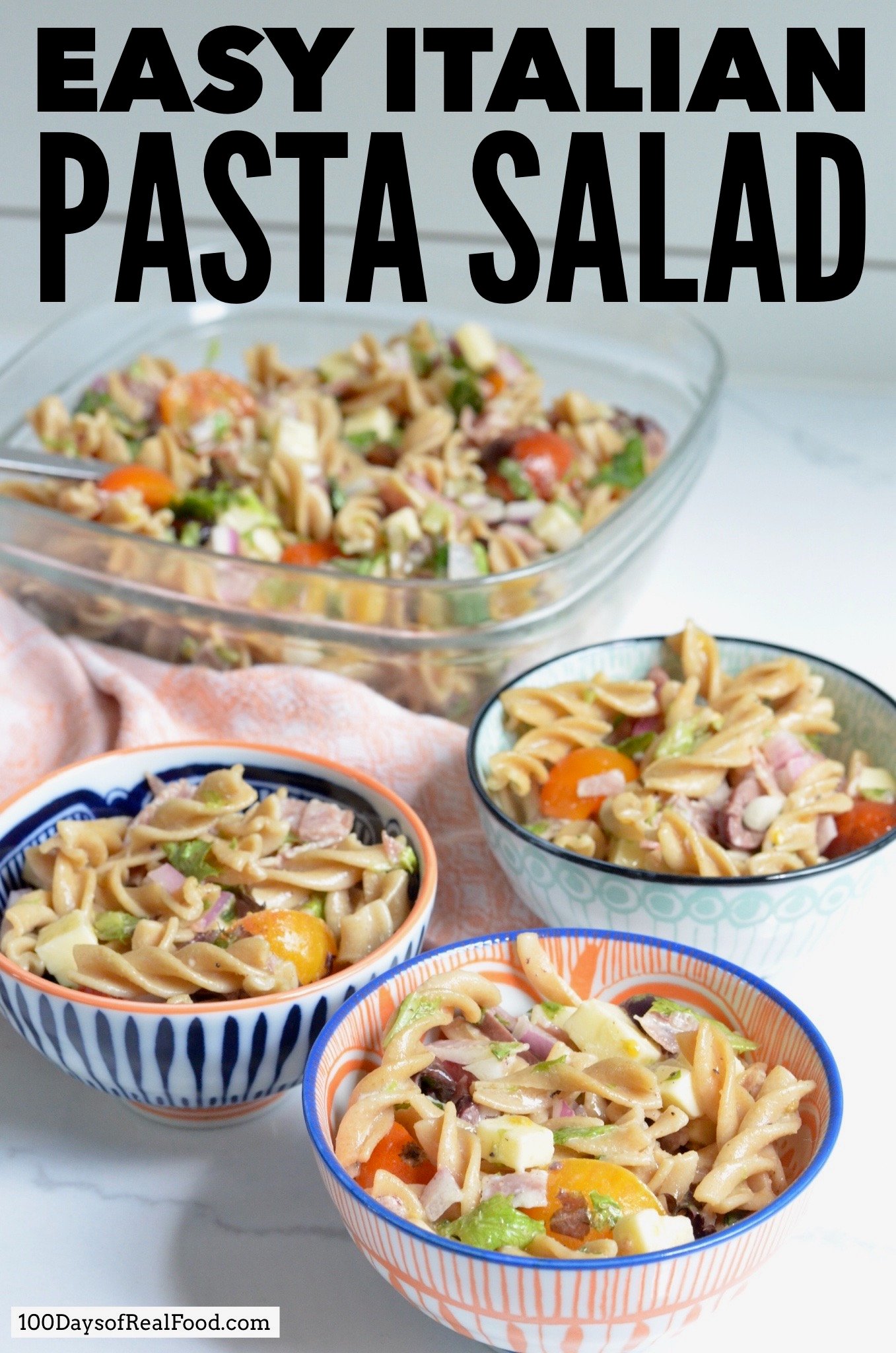 Four colorful bowls of homemade Italian Pasta Salad on the counter. 