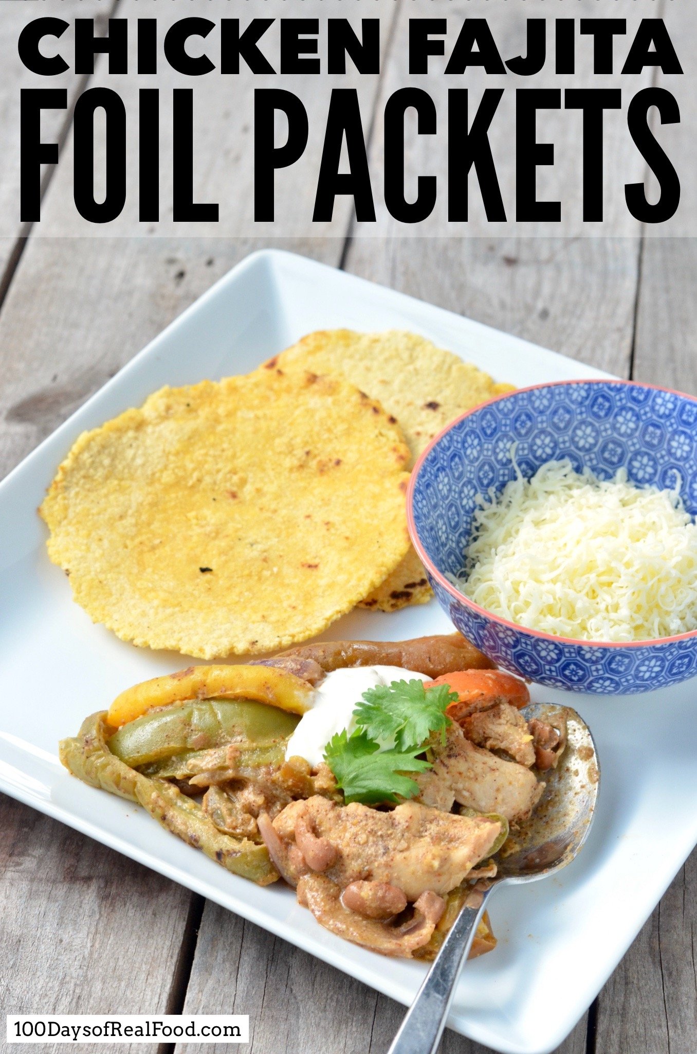 Plate of Chicken Fajitas with homemade corn tortillas and a bowl of cheese.