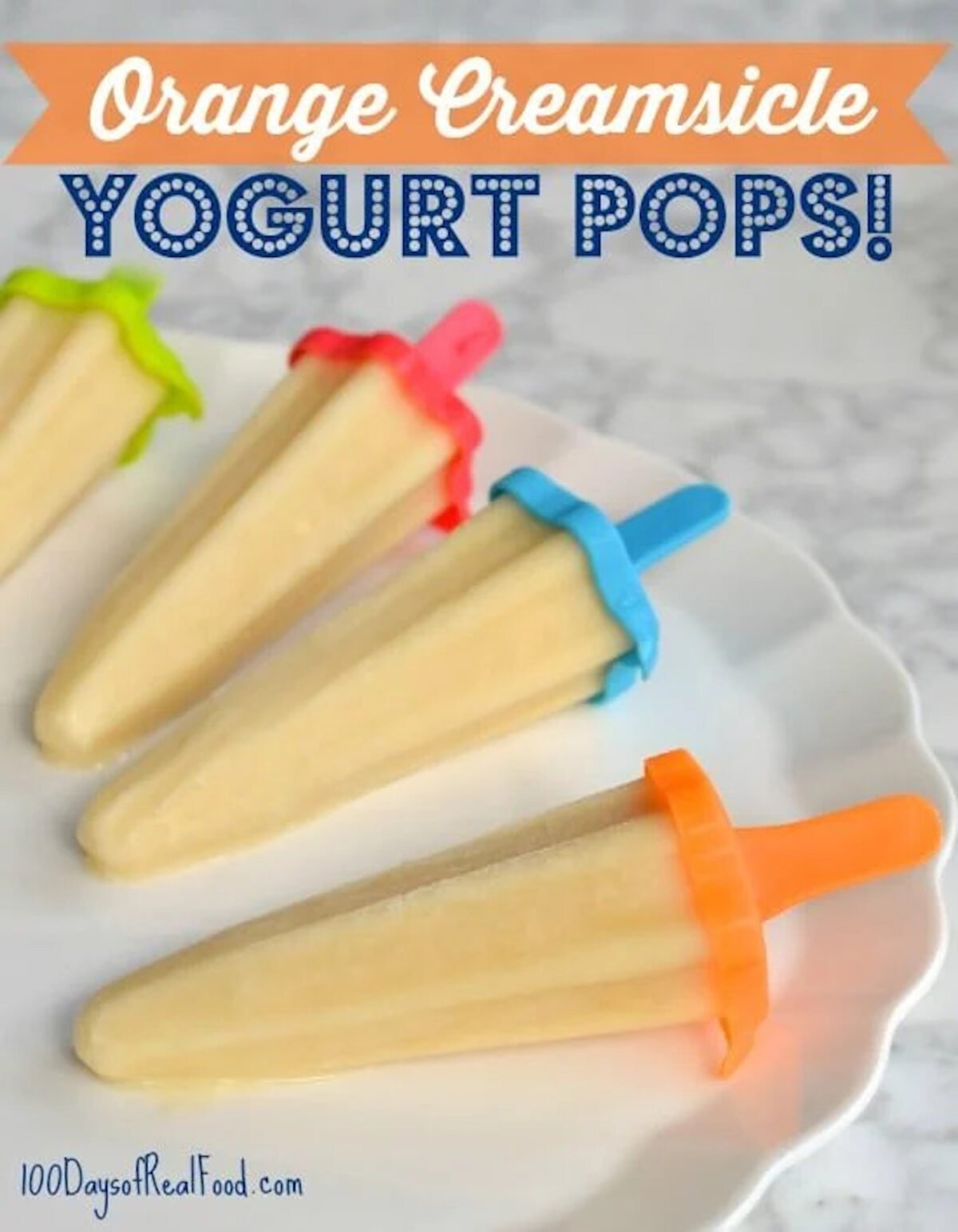 Four homemade orange creamsicle yogurt pops with bright colored handles on a white plate. 