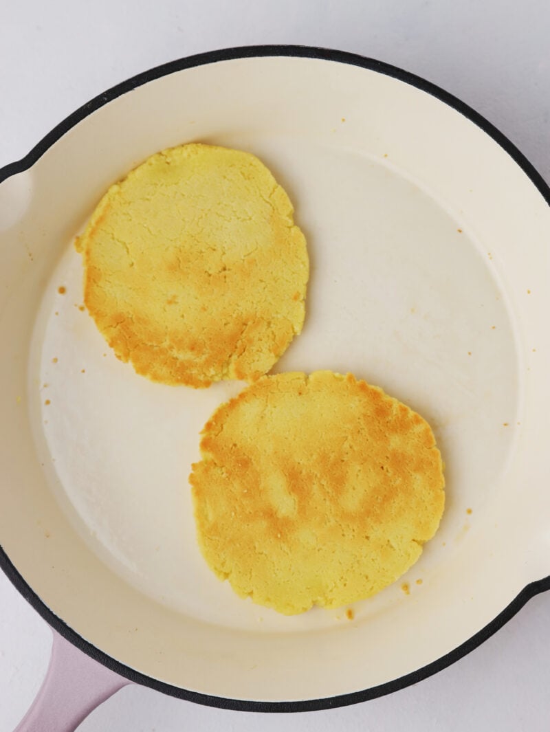 Golden brown cakes in pan.