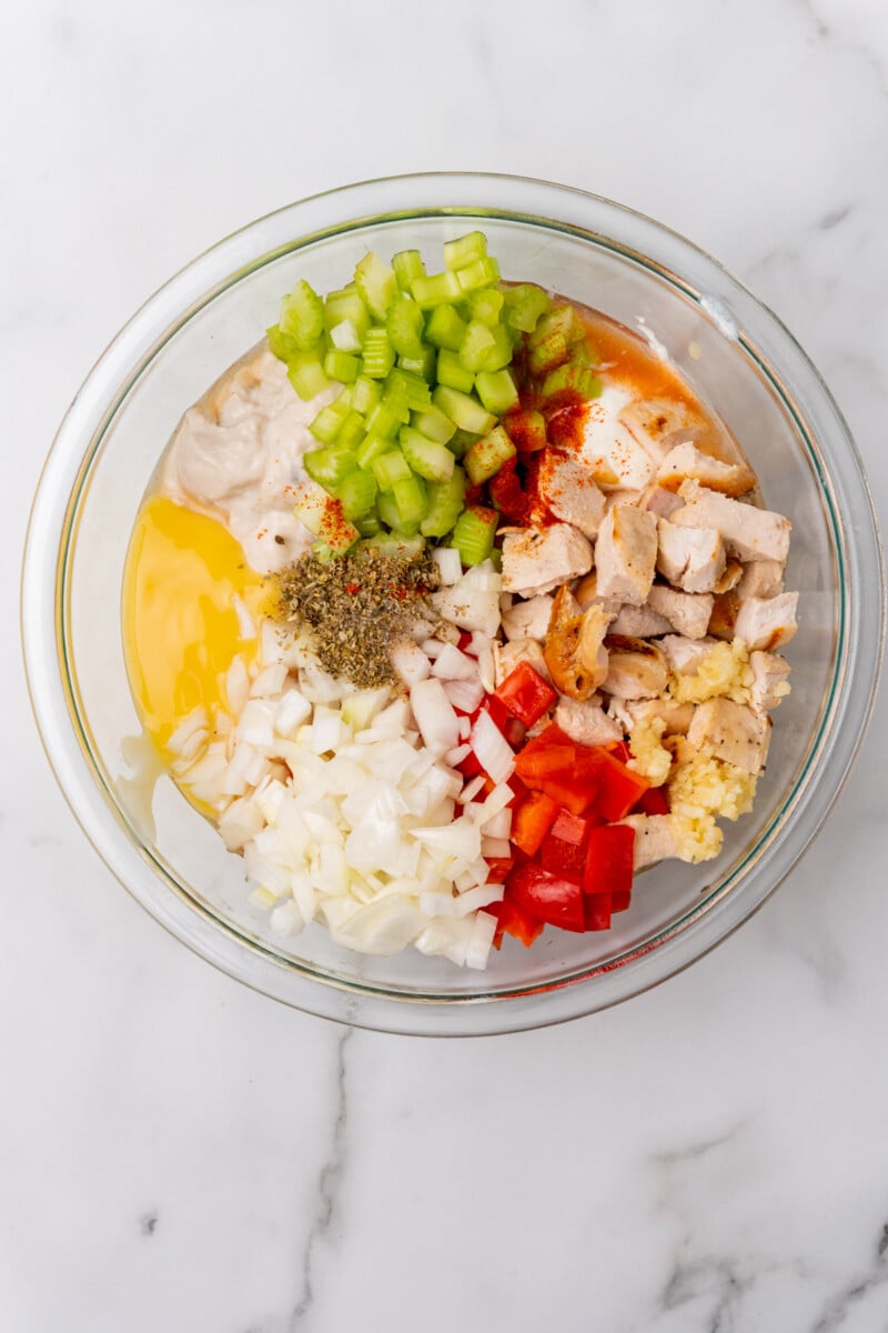 Chicken and chopped veggies in bowl.