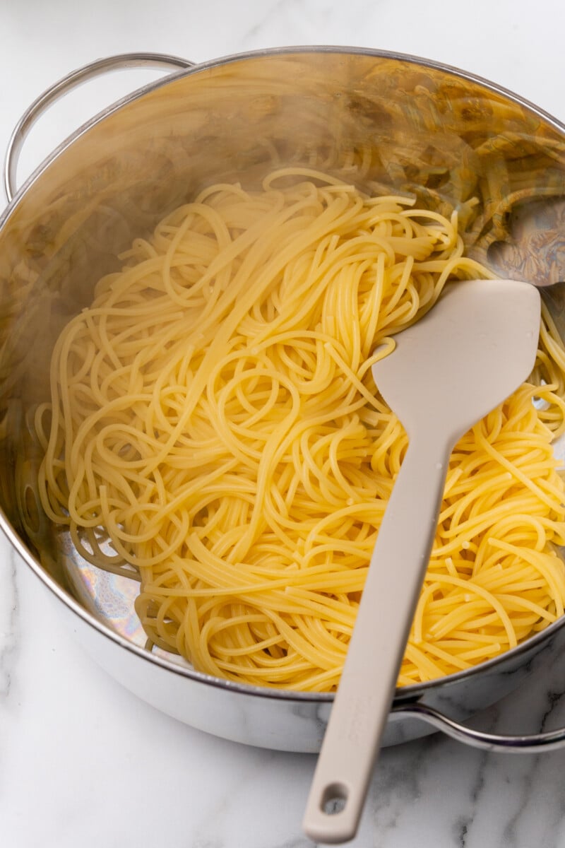 Add spaghetti to pan and cook.