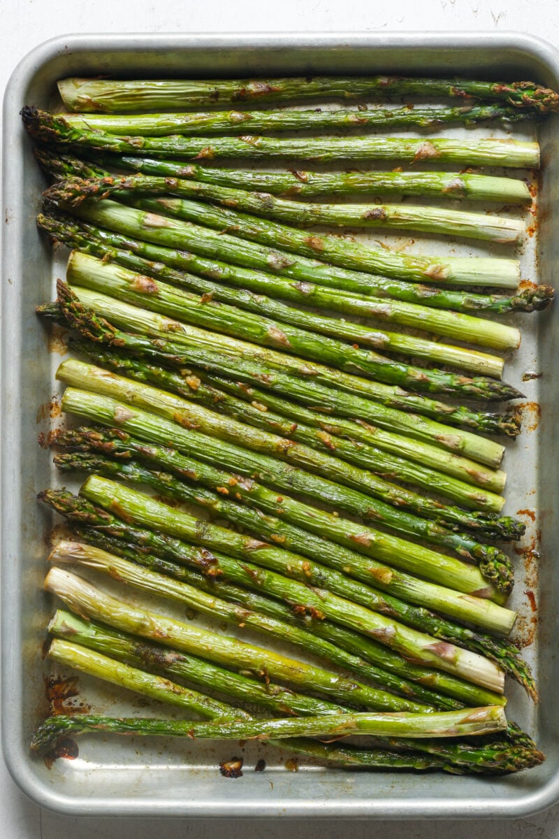 Roasted asparagus on pan.