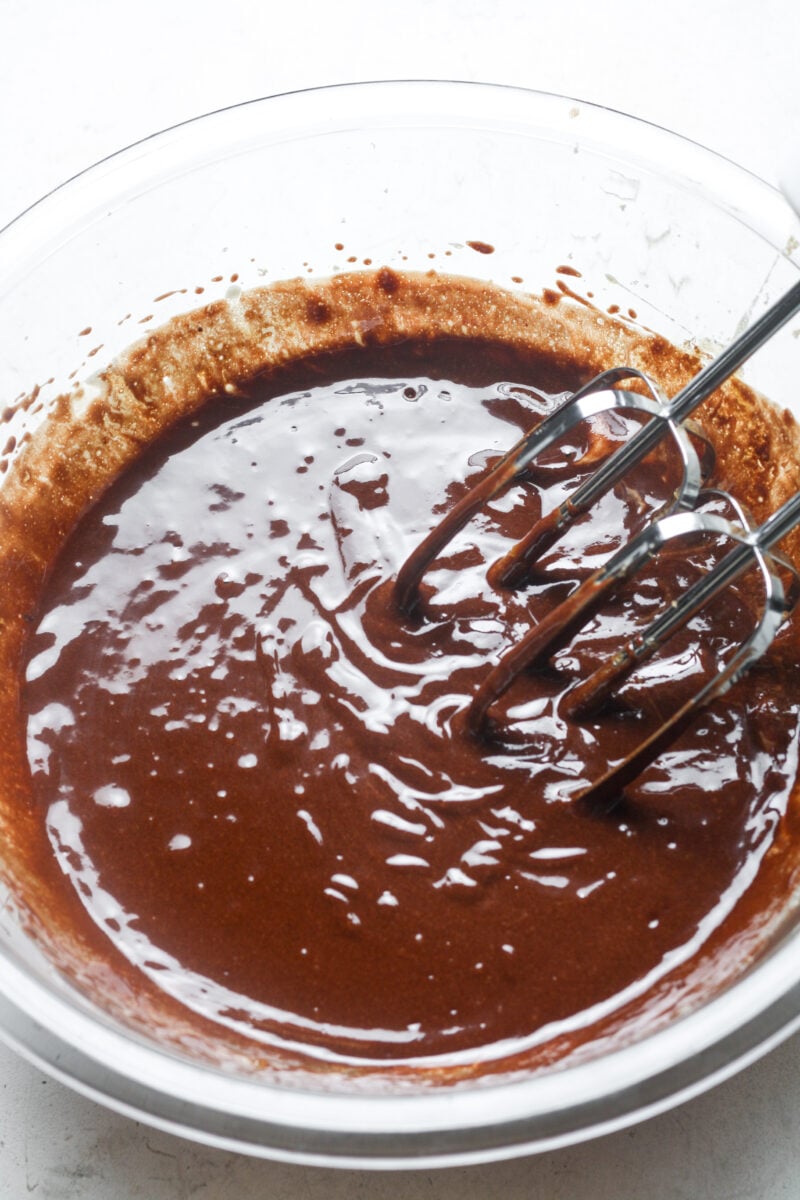 Hand mixer with chocolate.