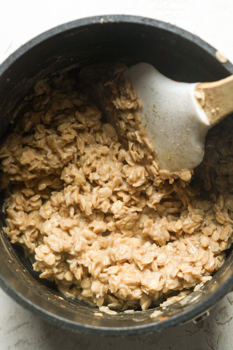 Thick oatmeal in pan.