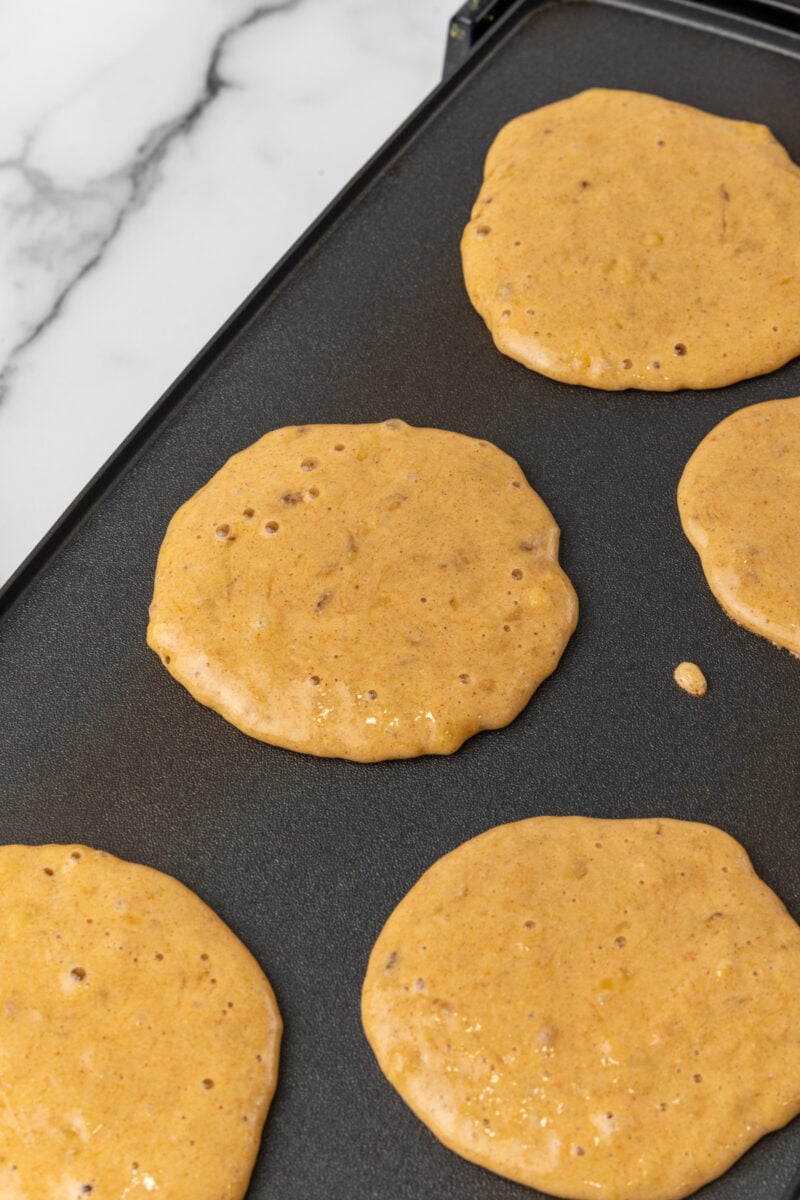 Pancakes on griddle.