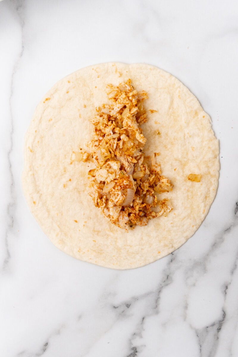 Tortilla with shredded chicken.