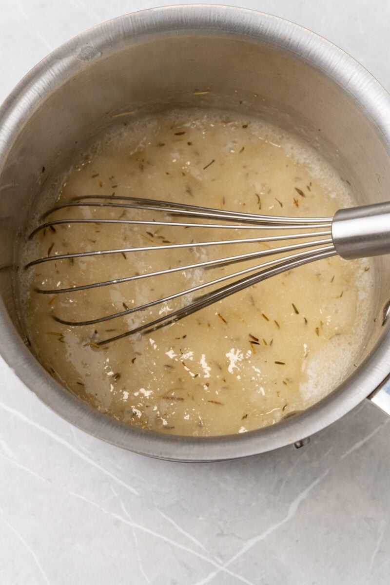 Thick gravy in saucepan.