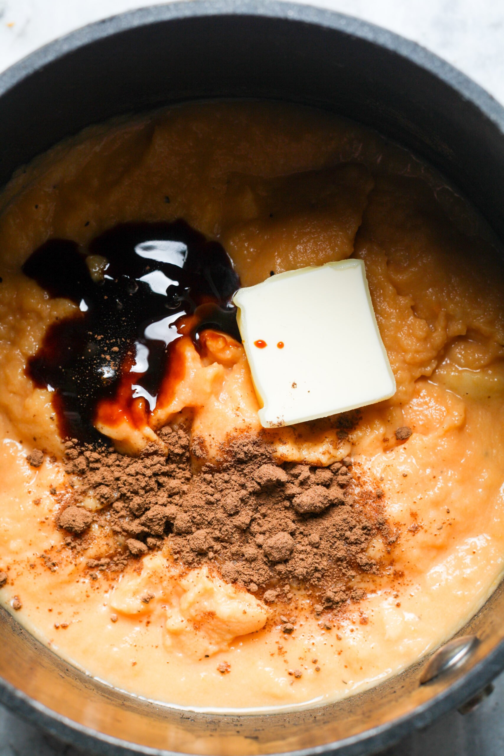 Butter and maple syrup in pan.