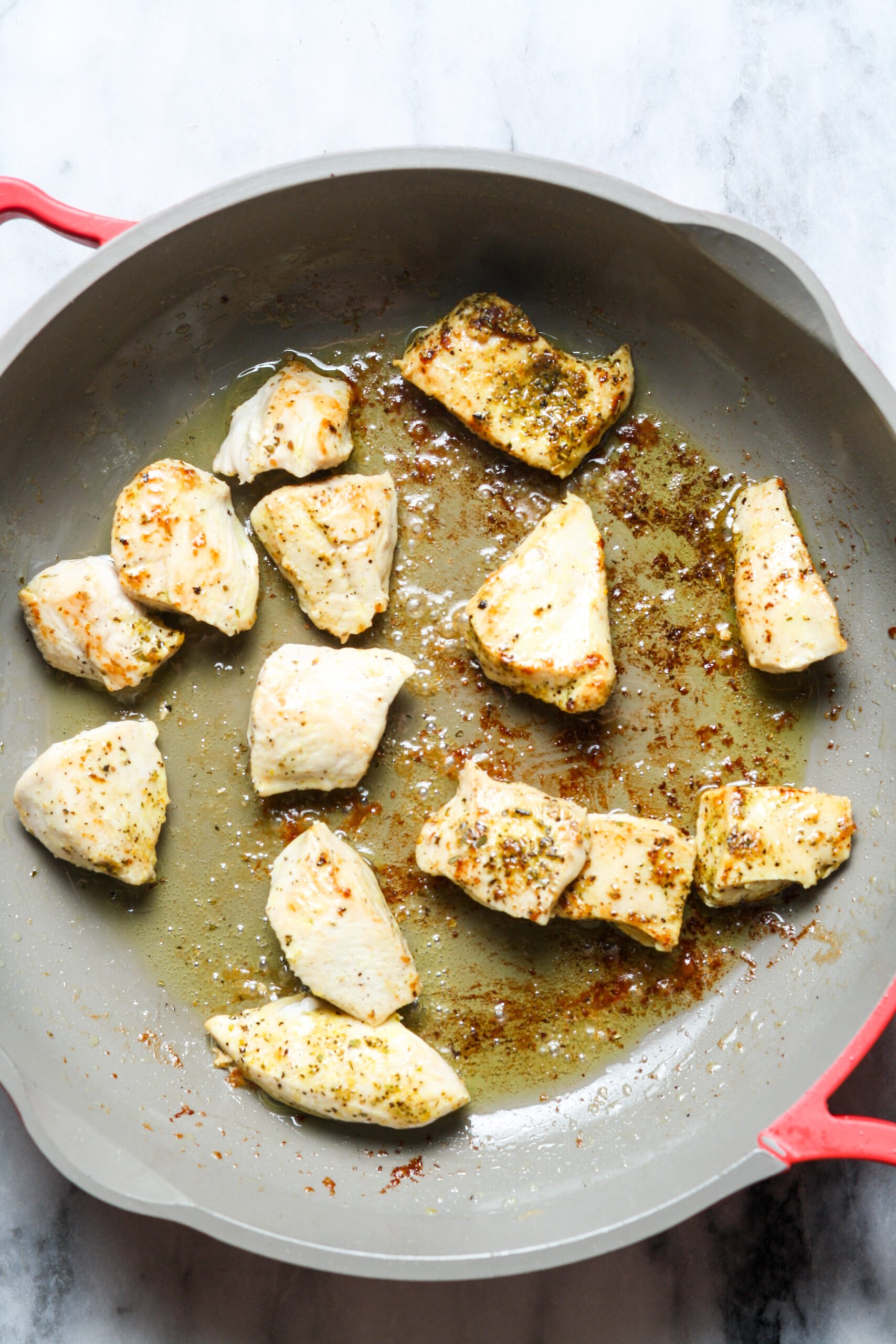 Big skillet with poultry.