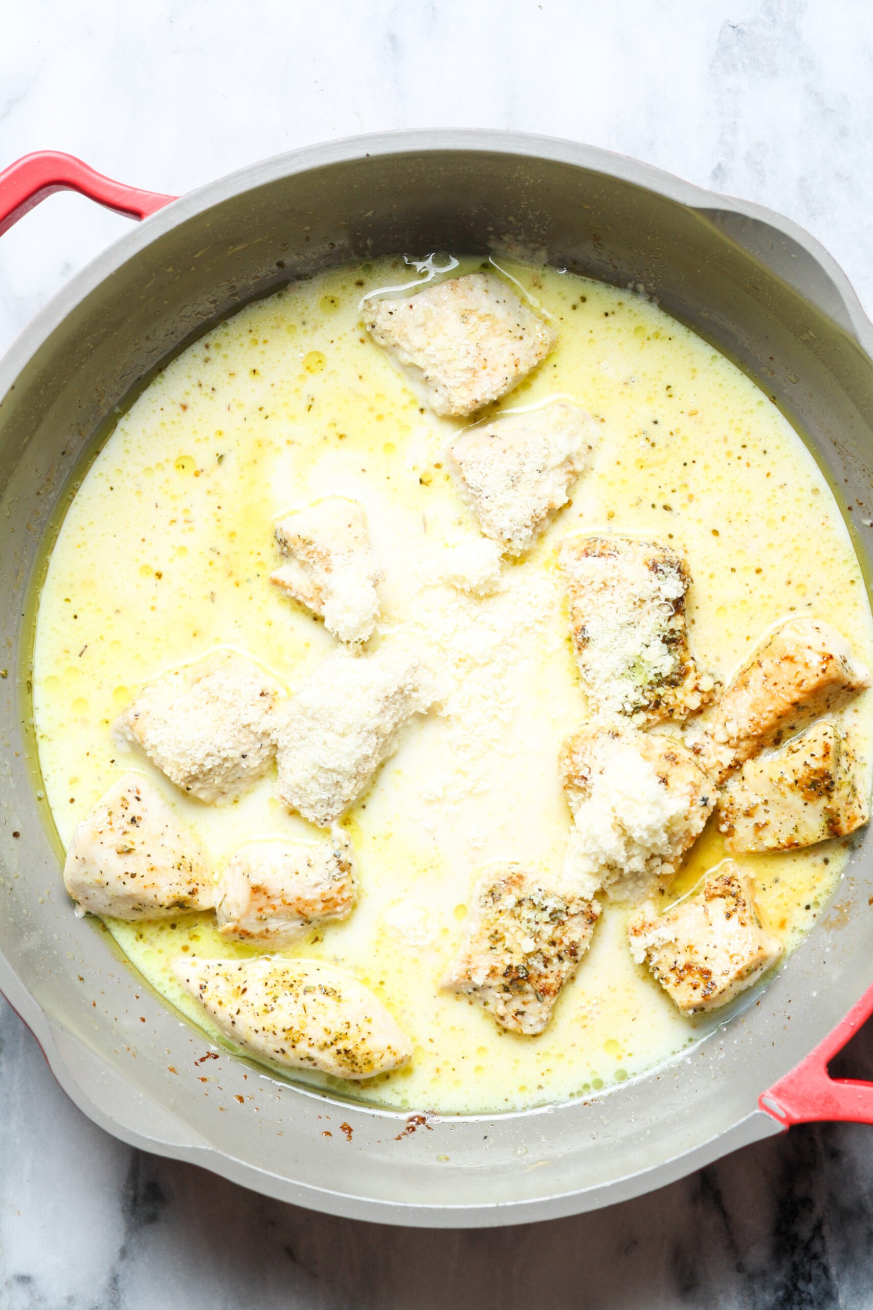 Cheesy sauce in pan.