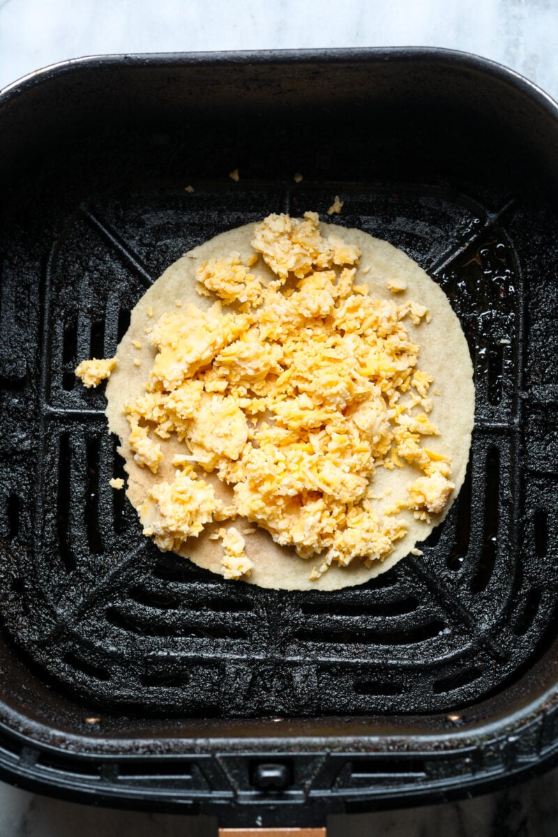 Tortilla with cheese shreds.
