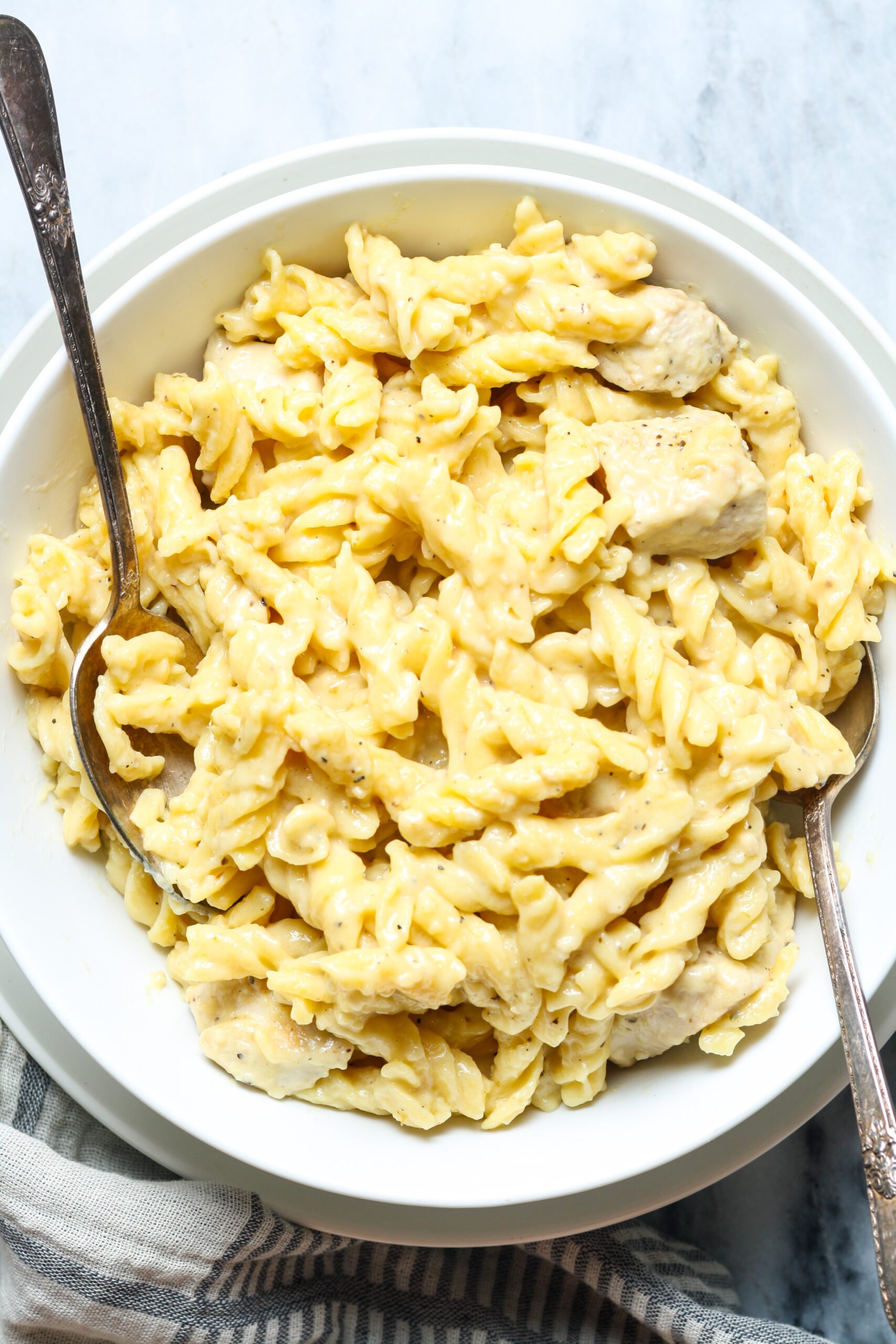 Bowl of noodles with sauce.