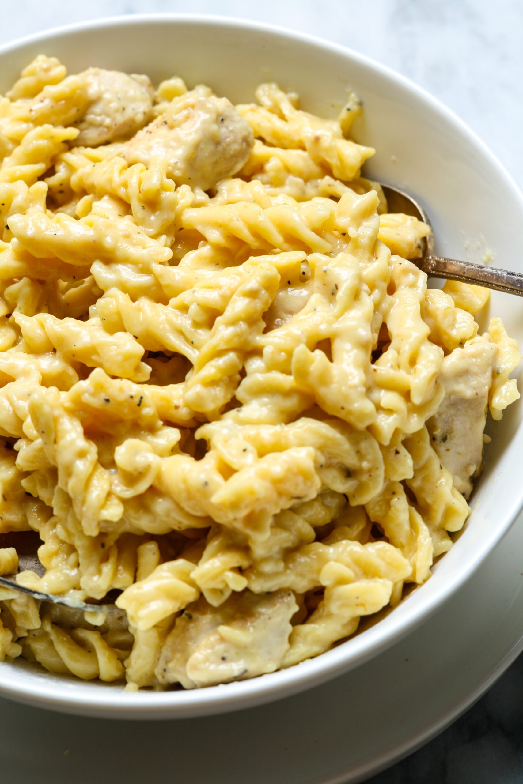 White bowl with noodles.